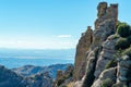 Stony peaks in the mountains of the arizona desert with rolling hills and ridges on roadside cliffs with blue hazy skies Royalty Free Stock Photo