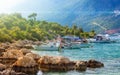 Stony sea bay with clear blue water and boats in resort city Kas in Turkey Royalty Free Stock Photo