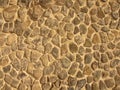 Stony wall from nature material, broken marl stone , traditional building materials.