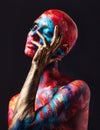 She stood out like never before. Shot of an attractive young woman posing alone in the studio with paint on her face and