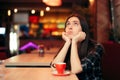 Bored Girl Waiting for her Date in a Coffee Shop Royalty Free Stock Photo