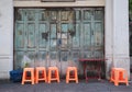 Stools and table in front of vintage door