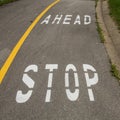 Stop ahead sign on the sidewalk Royalty Free Stock Photo