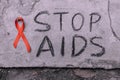 Stop Aids text hand write by black chacoal