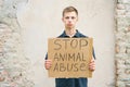 Stop animal abuse guy holding a cardboard box