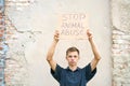 Stop animal abuse guy holding a cardboard box Royalty Free Stock Photo