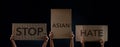 Stop Asian Hate Concept. Campaign, Protest or Expression Concept. Group of People Raised a Corrugated Paper with Text