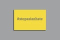 Stop Asian hate concept, text on Ultimate Gray and Illuminating Pantone colors of 2021 year background