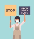 stop asian hate girl in mask holding banners against racism support people during covid-19 coronavirus pandemic Royalty Free Stock Photo