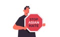 stop asian hate guy holding signboard banner against racism support people during coronavirus pandemic