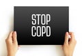 Stop COPD text on card, medical concept background