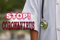 Stop Coronavirus or COVID-19 inscription on doctor background.