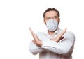 Stop coronavirus pandemics. Caucasian middle-aged man in formal shirt and a protective medical mask makes a prohibiting Royalty Free Stock Photo