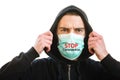 Stop Coronavirus text. Man wearing medical protective mask on a white wall background. Prevent Covid-19, flu. Virus, pandemic, Royalty Free Stock Photo