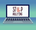 stop cyber bullying lettering and hand stoping in laptop