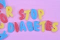 Stop Diabetes words on pink table Royalty Free Stock Photo