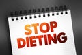 Stop Dieting text on notepad, concept background Royalty Free Stock Photo