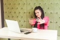 Stop doing it! Portrait of aggressive scared young girl freelancer with black dreadlocks hairstyle in pink blouse sitting with bad