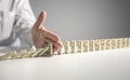 Stop the domino effect concept for business solution and intervention Royalty Free Stock Photo