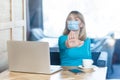 Stop, don`t come any closer. Portrait of serious young woman with surgical medical mask sitting and showing stop with hands and Royalty Free Stock Photo