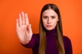 Stop dont move. Serious confident strict girl hold hand sign palm block way reject disagree solution wear good look Royalty Free Stock Photo