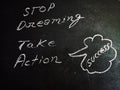 stop dreaming take action notes displayed on chalkboard concept