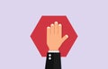 Stop forbidden. Hand holds polygonal red sign warning about danger of traffic prohibition. Royalty Free Stock Photo