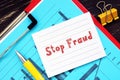 Stop Fraud inscription on the sheet