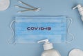 Stop the global pandemic COVID-19. Coronavirus prevention surgical masks and sanitizer gel. top view