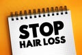 Stop Hair Loss text on notepad, medical concept background Royalty Free Stock Photo