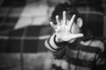 Stop hand of child, black and white. Royalty Free Stock Photo