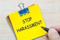 Stop harassment text on yellow sticky notes representing standing up against abusive behavior and injustice Royalty Free Stock Photo
