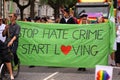 Stop hate crime start loving - demonstration against hate crimes - people carrying a banner