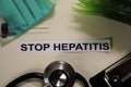 Stop Hepatitis with inspiration and healthcare/medical concept on desk background