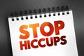 Stop Hiccups text quote on notepad, concept background