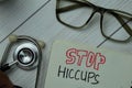 Stop HICCUPS write on a book isolated on office desk. Healthcare or Medical concept