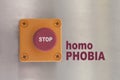 Industrial switching button with text: stop homophobia