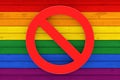 Stop LGBT Concept. Prohibit Symbol over Rustic Old Weathered Wood Plank Background Texture in colours of LGBT Pride Flag. 3d Royalty Free Stock Photo