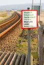 Stop, Look and Listen sign on train track