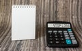 Stop Loss concept on calculator display, on wooden table with notepad for writing Royalty Free Stock Photo