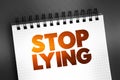 Stop Lying text quote on notepad, concept background