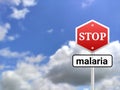 Stop malaria sigh board on blur sky background