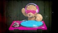 Teddy bear djing on turntables with headphones