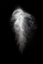 Stop motion of white dust explosion isolated on black background Royalty Free Stock Photo