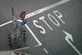 Stop and other notice safety signs on the airport terminal road. Directional arrow mark on asphalt Royalty Free Stock Photo