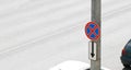 Stop and parking prohibited road sign hangs on a pole against the background of a road with cars. Violation of traffic Royalty Free Stock Photo