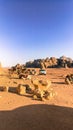 Stop for pick up trucks and bedouin camels in the middle of Wadi Rum desert.