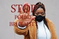Stop police brutality. African american woman, wear black face mask show stop hand sign