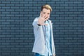 Stop! Portrait of anger handsome young blonde man in casual style standing with stop sign gesture and looking at camera, focus on