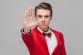 Stop. Portrait of confident gentleman showing prohibition hand gesture, saying no, forbidden. white